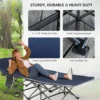 Backpacker-carrying-folded-camping-cot-on-hiking-backpack-in-mountains
