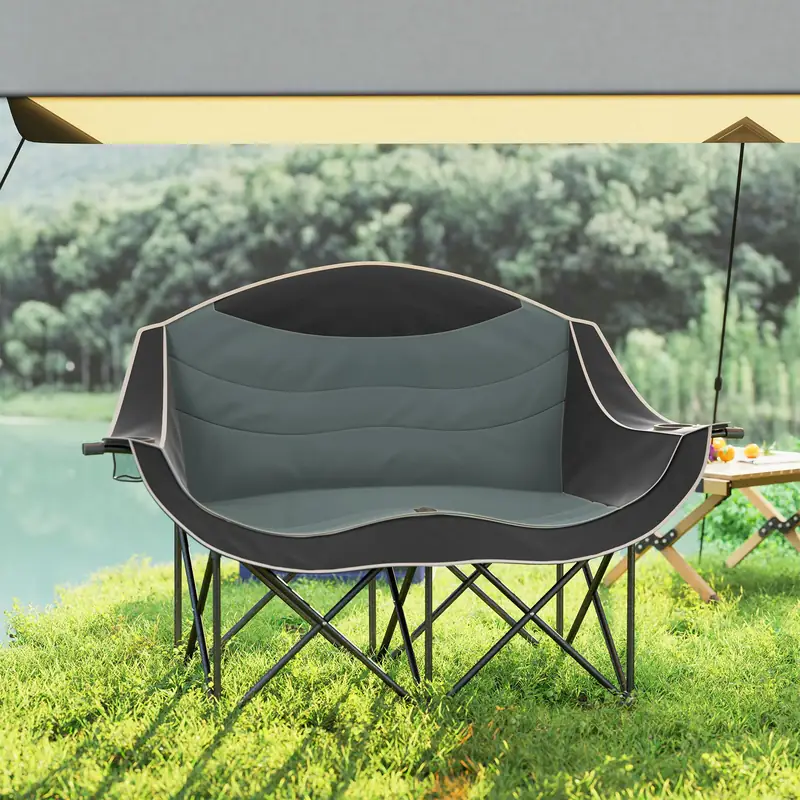 ZenithOut double camping chair placed next to a camping tent and hammock for multi-scene usage. ZenithOut double camping chair placed next to a camping tent and hammock for multi-scene usage.